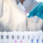 A scientist busy testing soil for DNA.