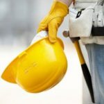 A person holding a hard hat.