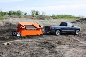 The EZ Screen-550 (Now the EZ-Screen 600) Topsoil screener towed by a pickup truck